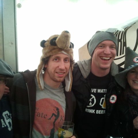 A group of friends in assorted hats, including a furry animal hat