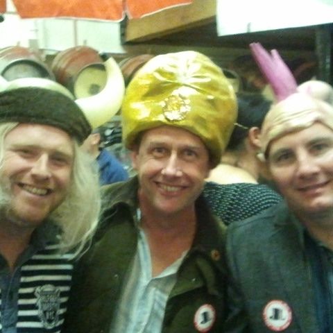 Close-up of the Viking-helmet and gold-hat crew, all smiles