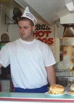 Someone cooking in a hat