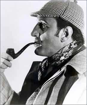 Basil Rathbone as Sherlock Holmes in a deerstalker